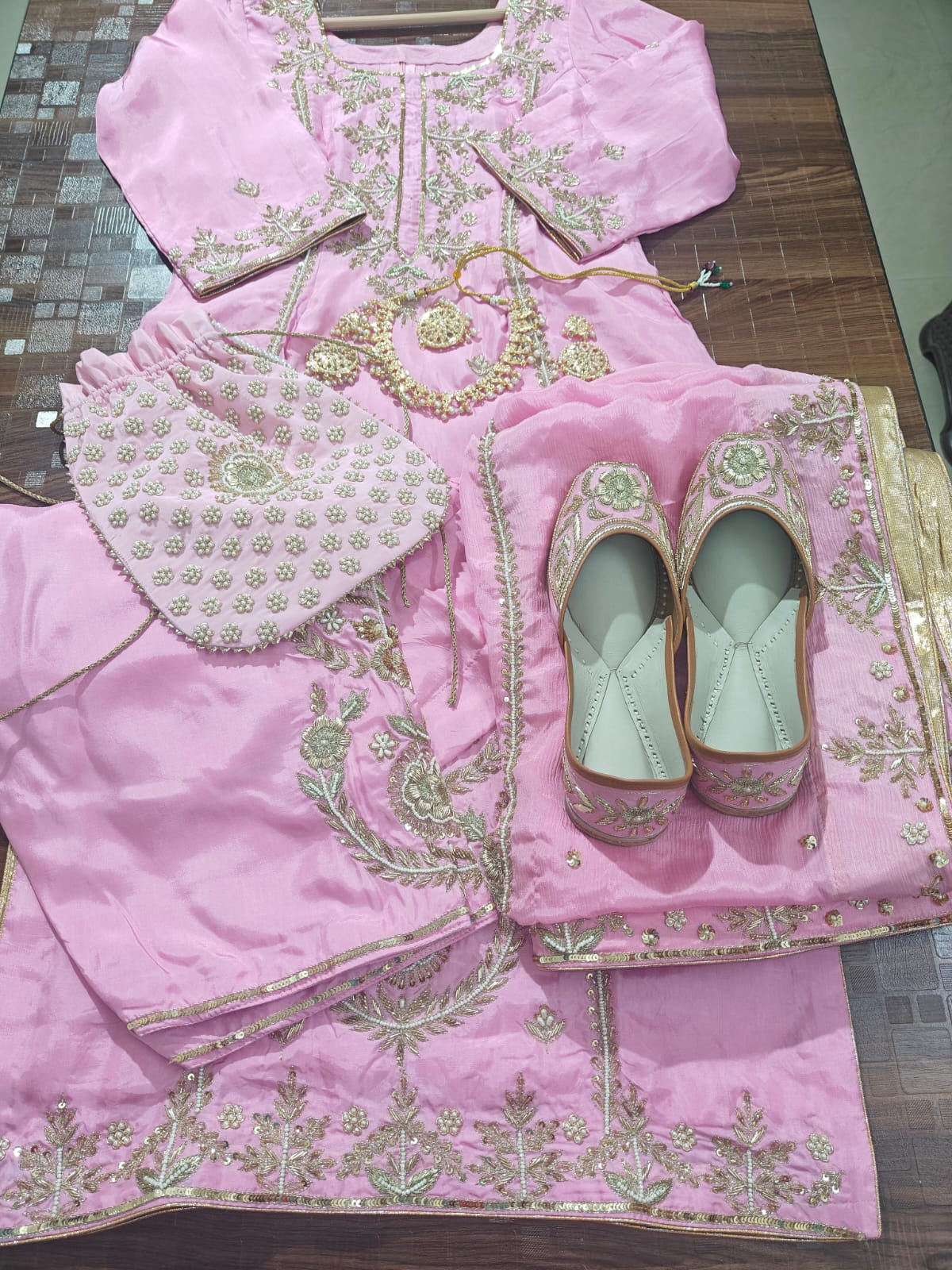 Heavy hand embroidered pink suit with punjabi jutti